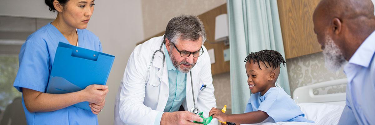 doctor playing toys with child